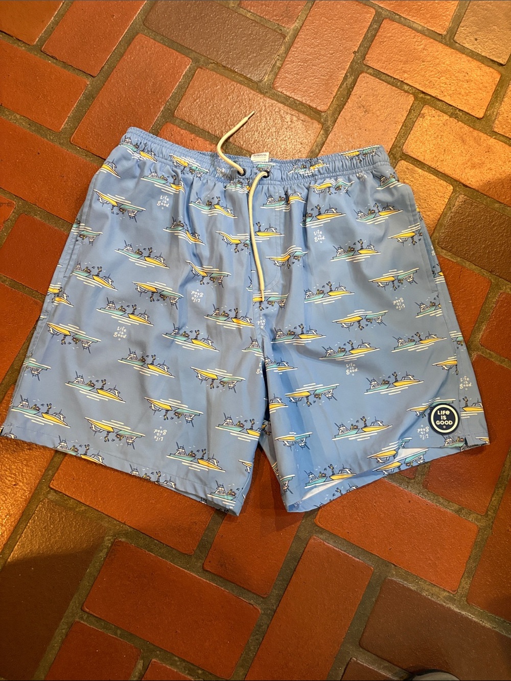 Life Is Good Light Blue Men's Swim Board Shorts with Boat Print
